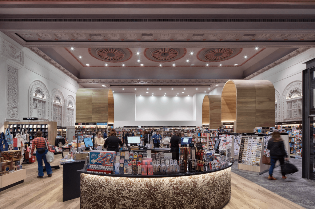 Heritage ceiling roses, large custom timber curved features and marbled concrete service counter for this retail fit out for Dymocks